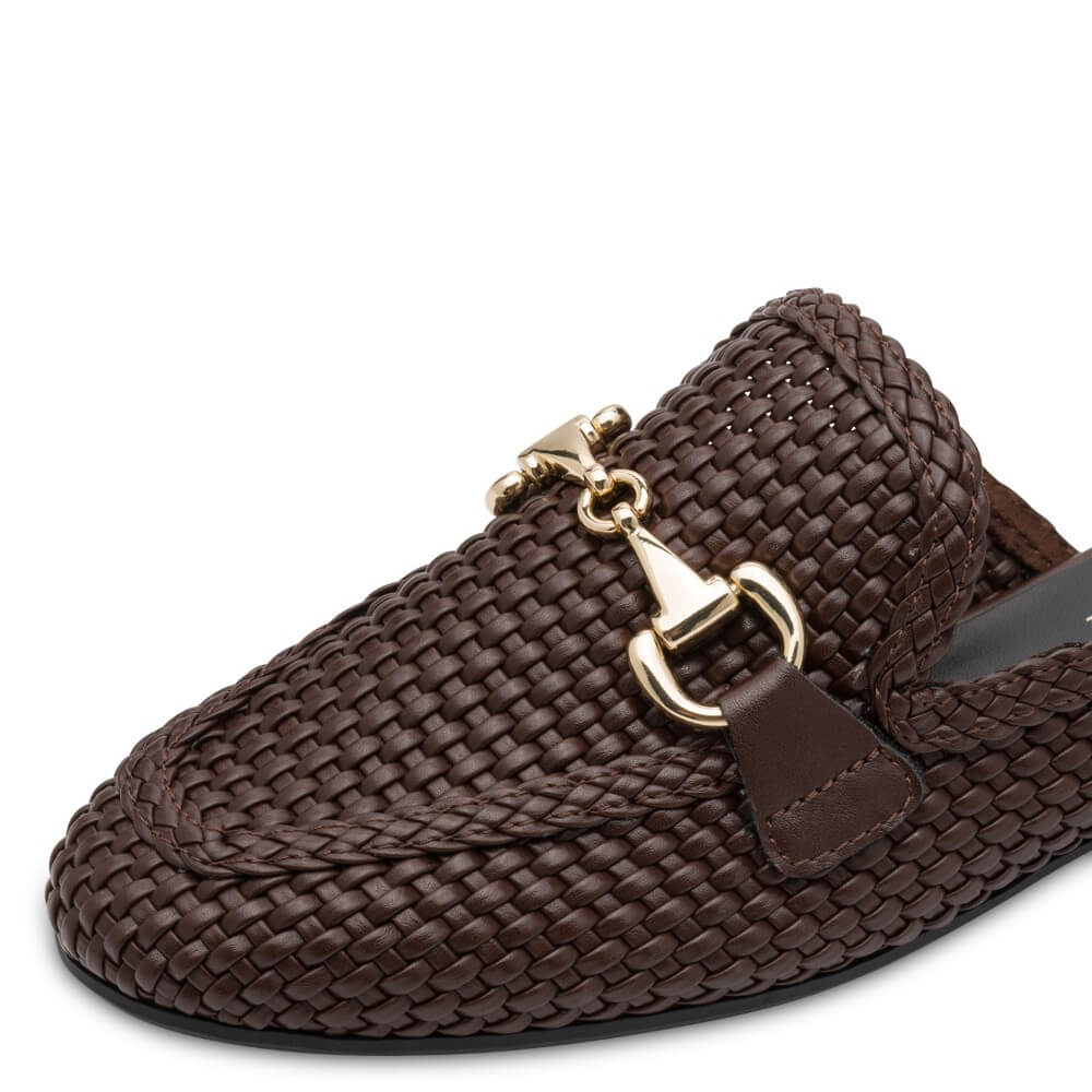 marco Tozzi 2-87300 Brown woven slipper with gold buckle and '100% Vegan' label on a white background