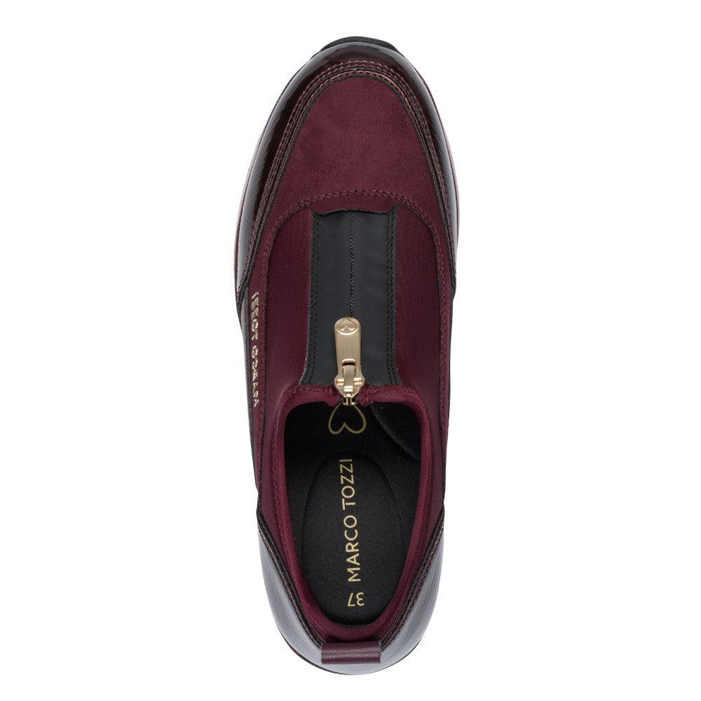 Maroon slip-on shoe with gold zipper and 'Marco Tozzi' branding on a white background