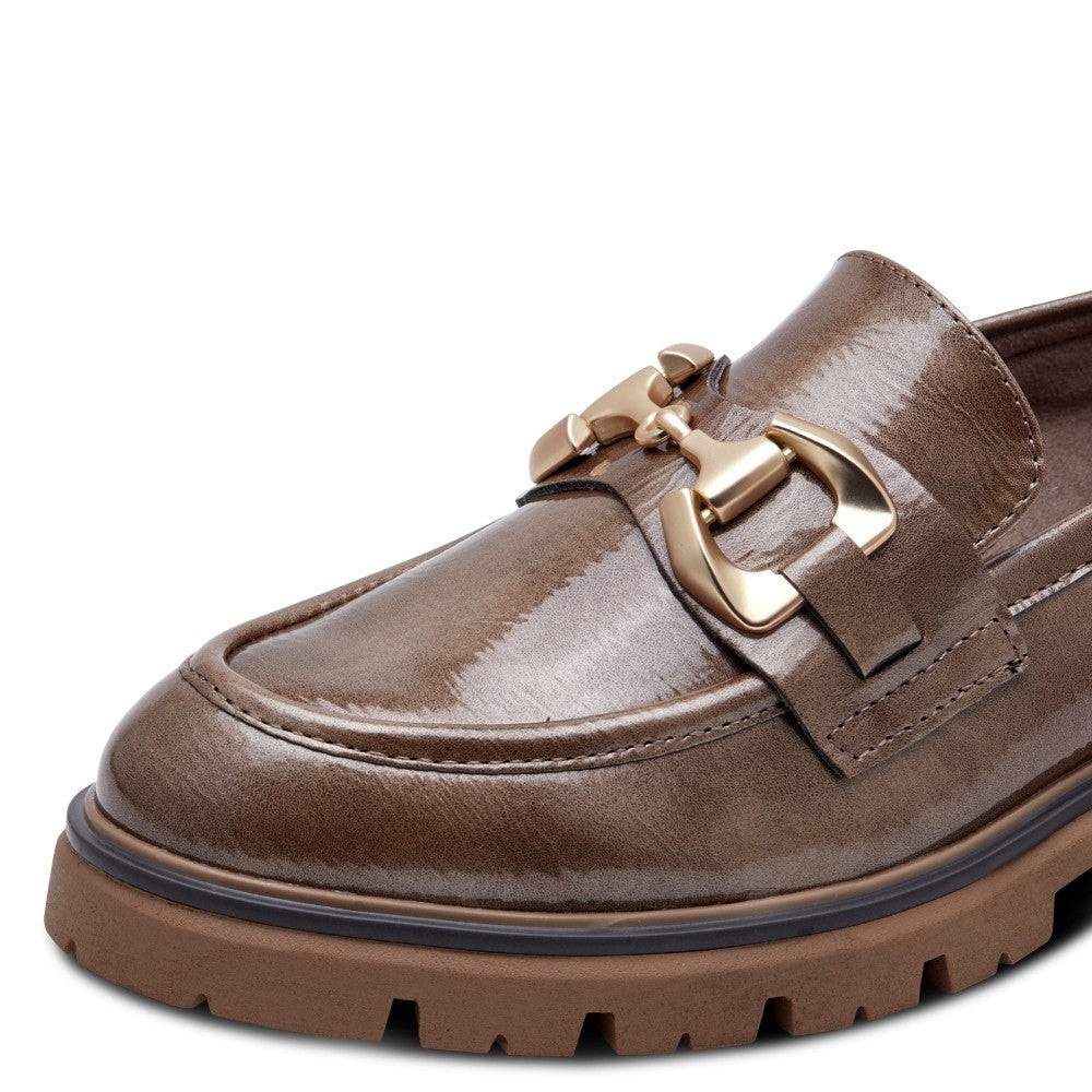 Brown loafer shoe with gold buckle and '100% Vegan' label on a white background Marco Tozzi Vegan Patent Loafer 2-24700 Taupe