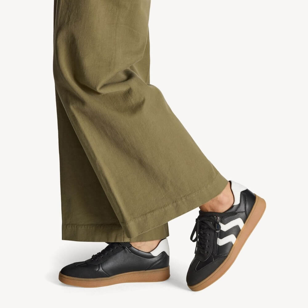 Black and white sneaker with brown sole and '100% Vegan' label on a white background Marco Tozzi Vegan Sneakers 2-23739-BLACK
