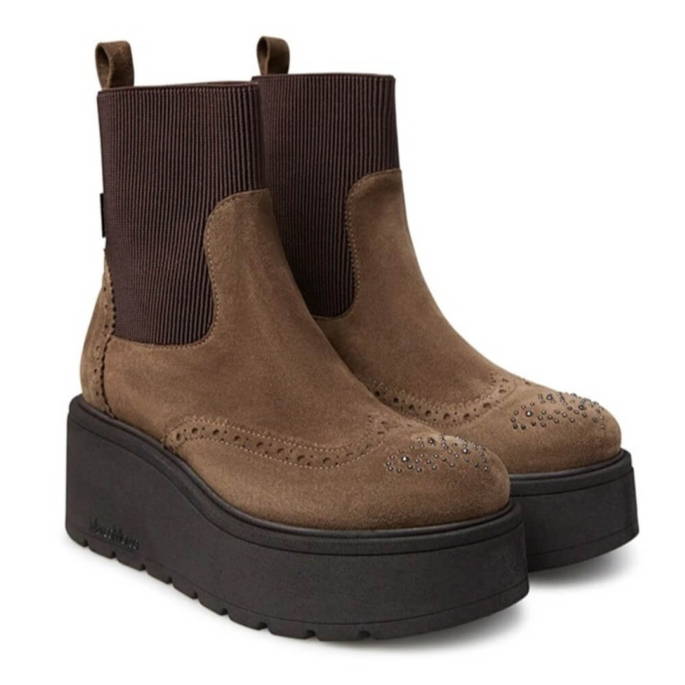 Pair of brown suede platform boots on a white background