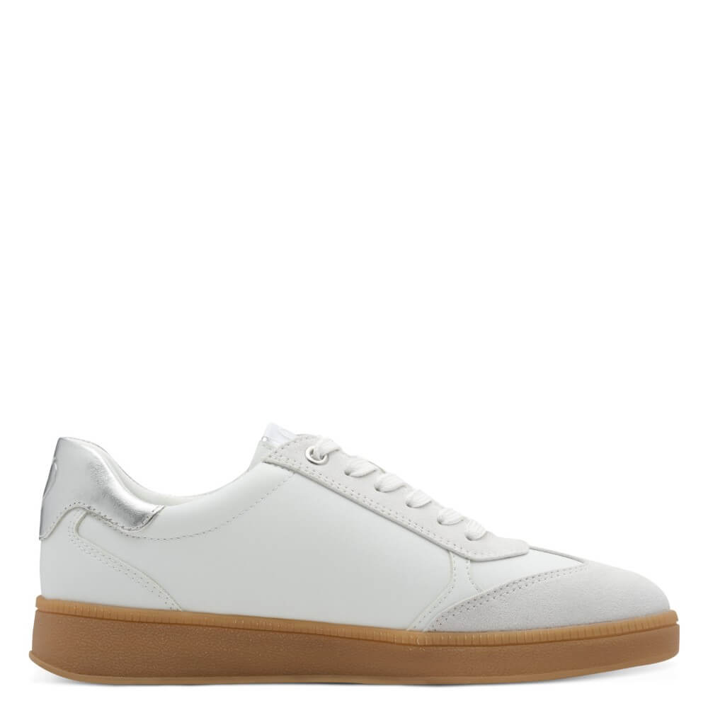 White sneaker with a brown sole on a white background