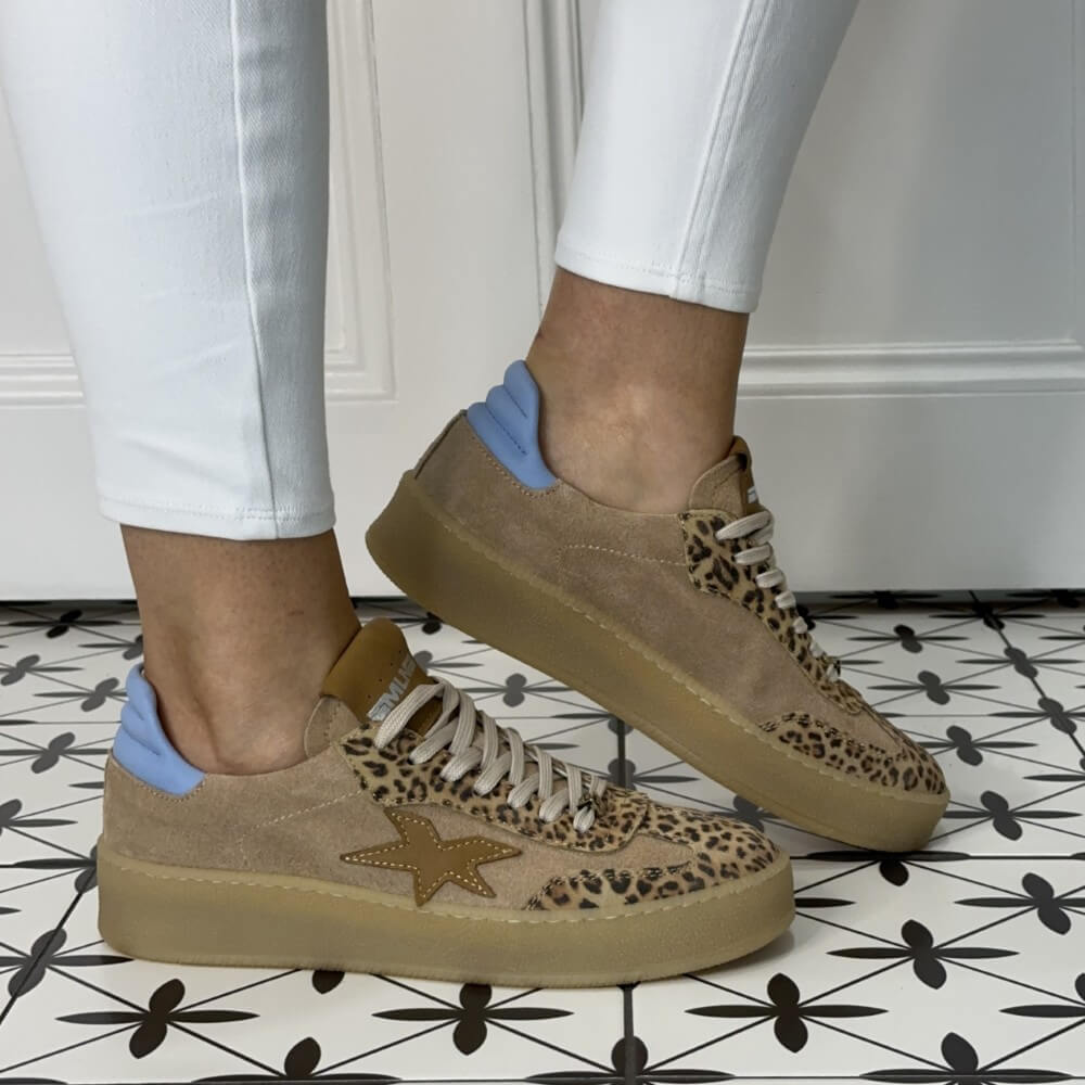 Meline Leopard print trainers worn with white jeans on tile floor