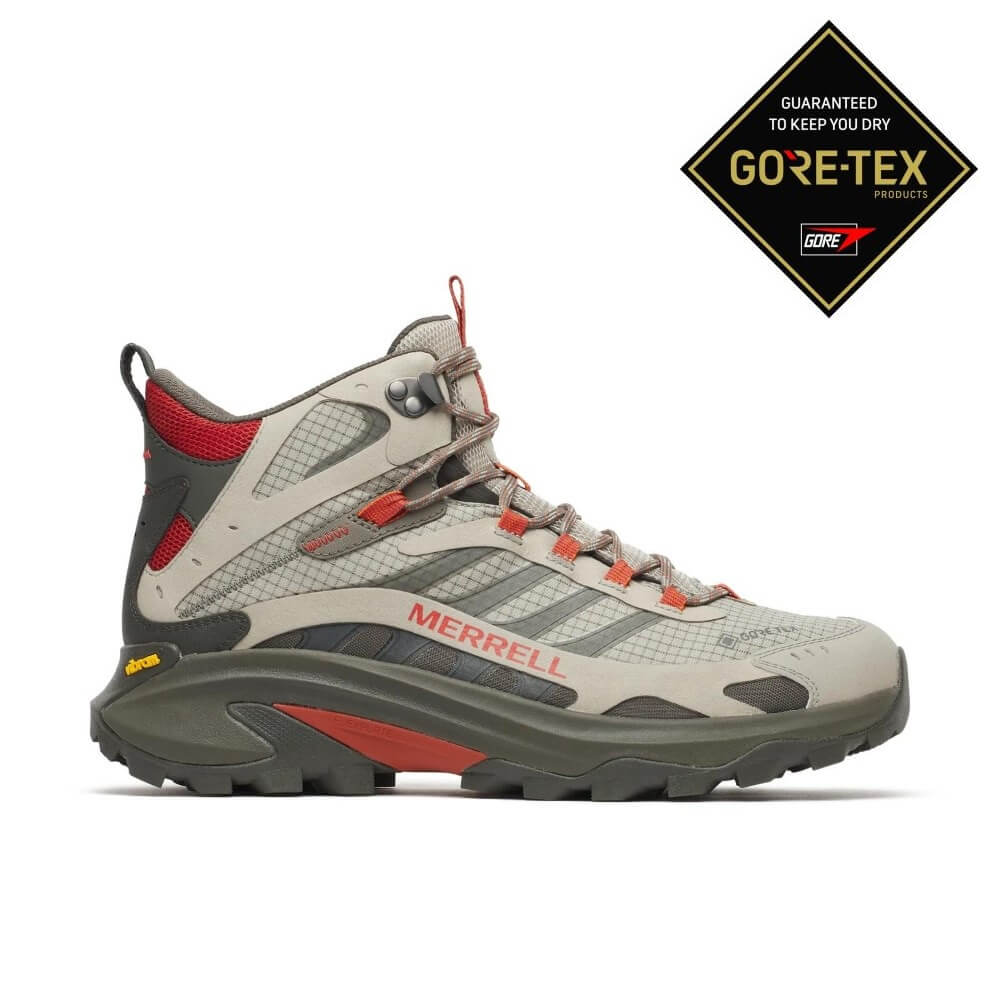 A Merrell mid-height hiking boots in light grey and dark grey with orange-red accents, shown on a white background with a black and gold Gore-Tex logo badge in the top right corner.
