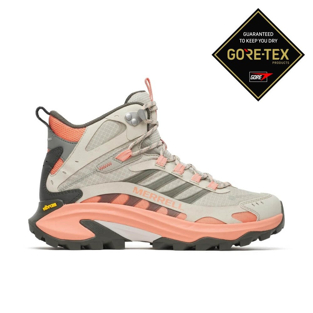 A Merrell Gore-Tex mid-height hiking boot in light grey and coral pink, featuring a Vibram sole, shown from a side profile on a white background.
