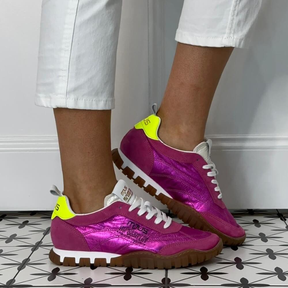 Mjus Pink Purple sneakers with yellow accents worn by a person on a patterned floor.