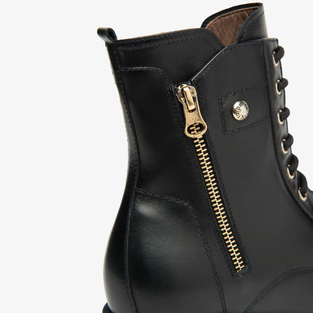 Black leather boot with gold zipper and laces on a white background NeroGiardini Leather Combat Boots I514861D Black