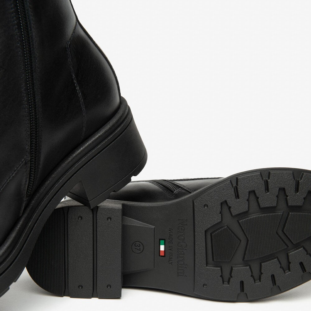 Black leather boot with gold zipper and laces on a white background NeroGiardini Leather Combat Boots I514861D Black