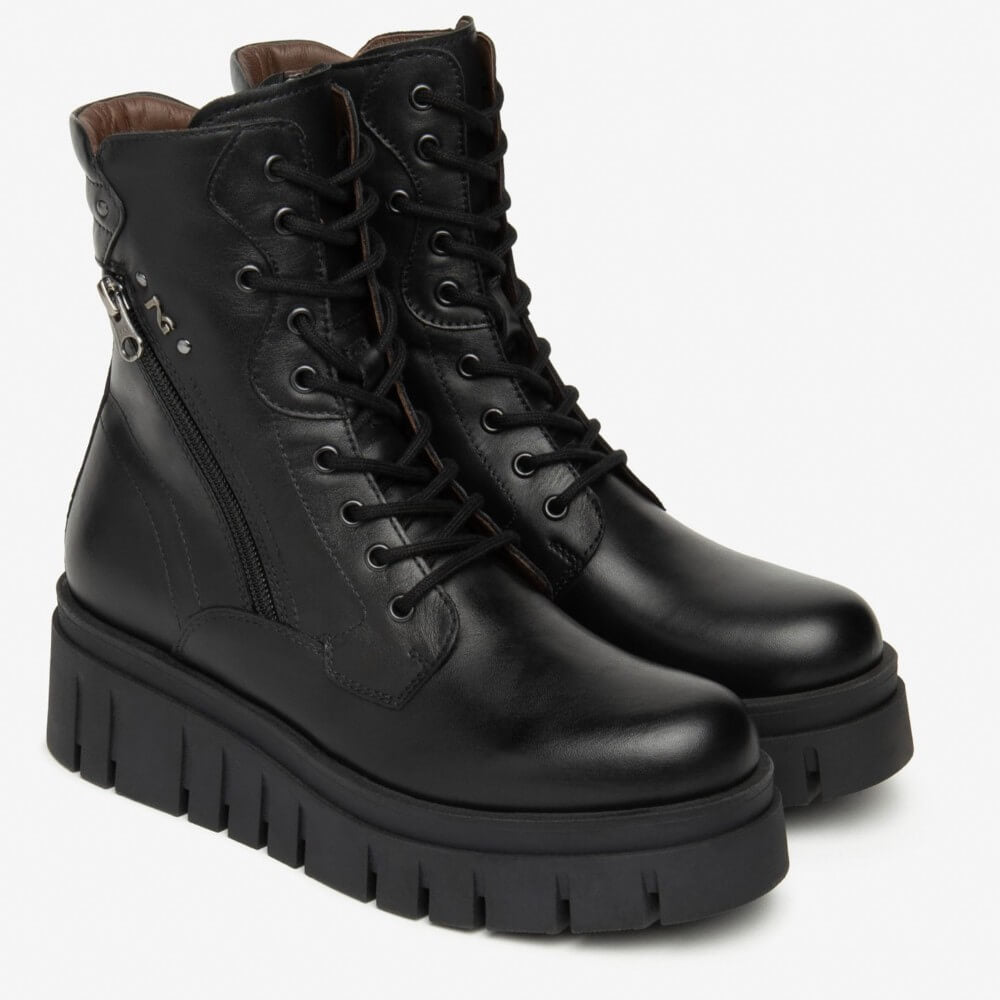 Black leather boot with a thick sole on a white background NeroGiardini Leather Combat Boots I514910D Black