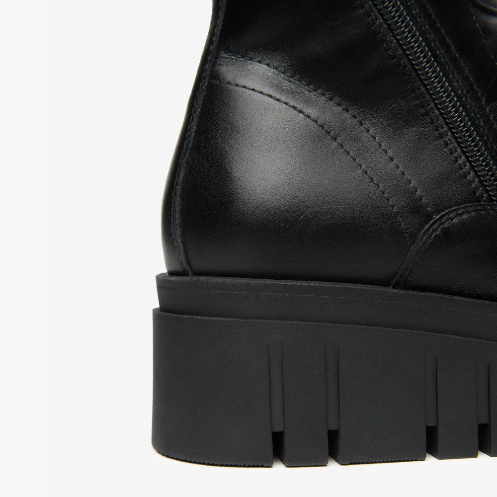 Black leather boot with a thick sole on a white background NeroGiardini Leather Combat Boots I514910D Black