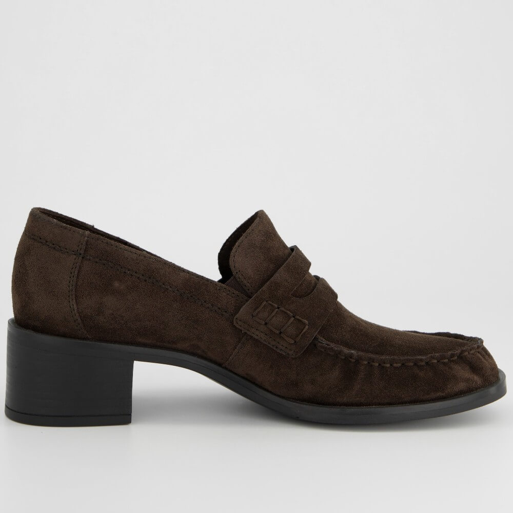 A Paul Green dark brown suede loafer with a low block heel and a decorative strap detail across the vamp, shown in profile against a light grey background.