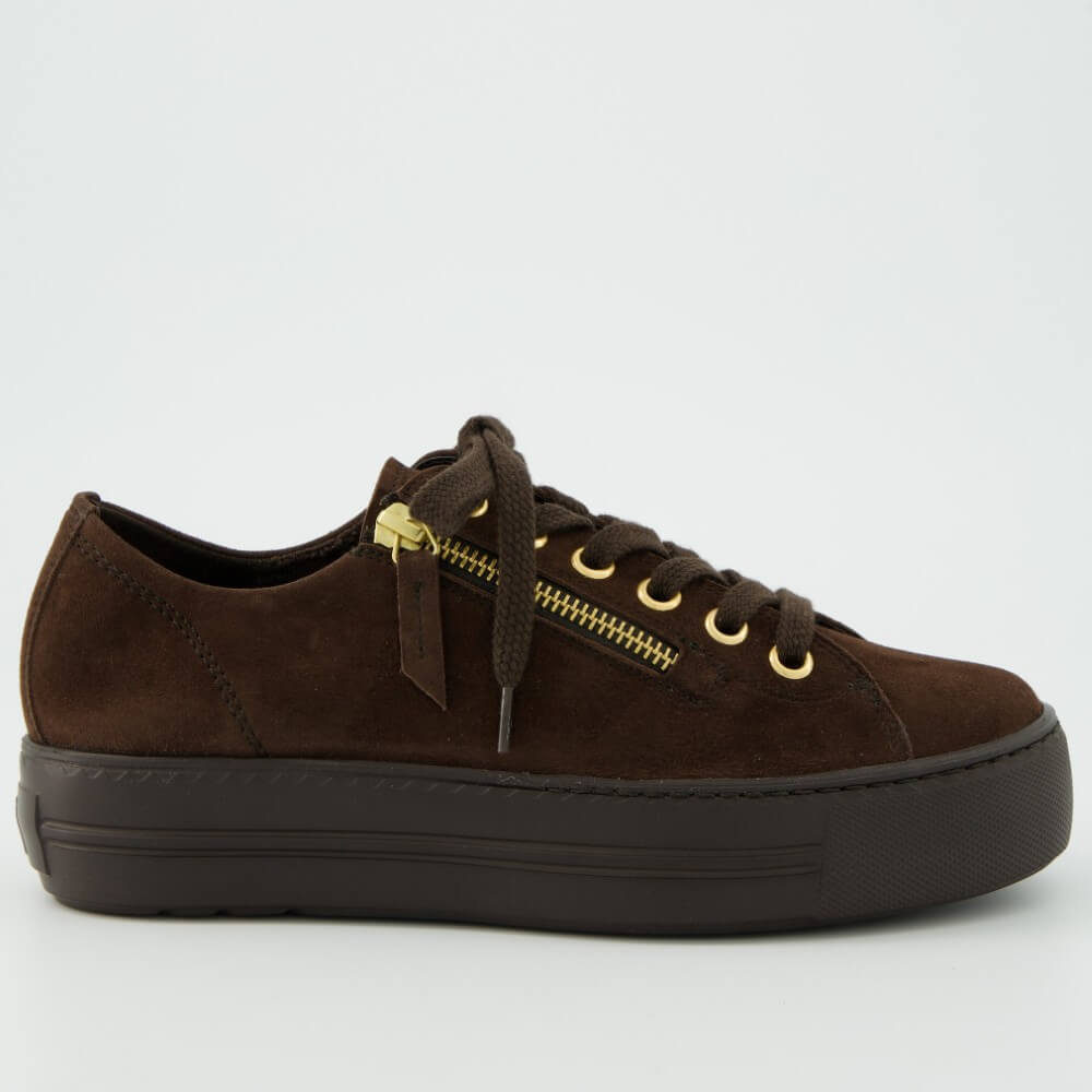 A Paul Green dark brown suede low-top sneaker with a matching dark brown platform sole, brown laces, and gold-tone metal eyelets and zipper accents, shown on a light grey background.