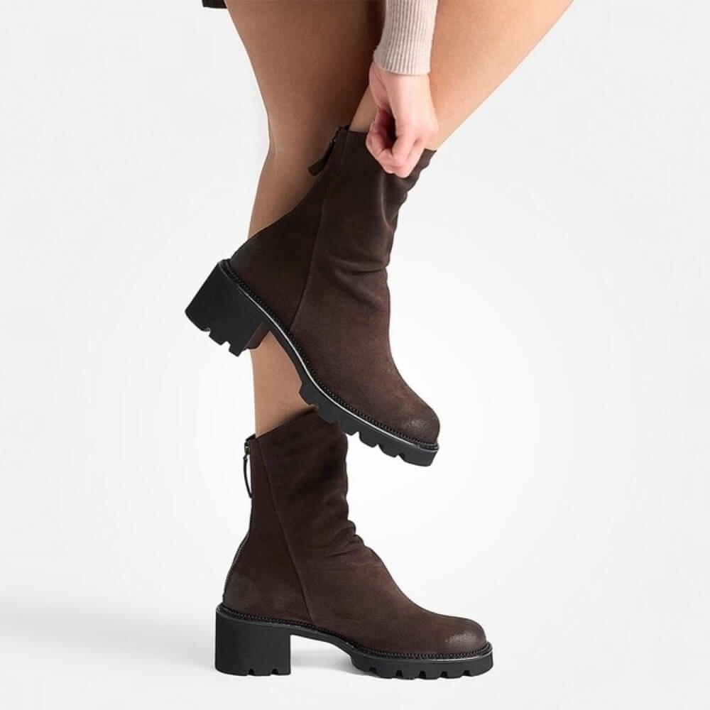 Person wearing Paul Green Brown Suede Ankle Boots with a back zip