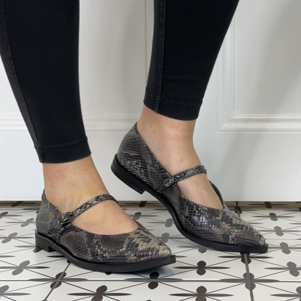 Paul Green 1127 Mary Jane Boa Snake. Gray snake print flats worn with black leggings.