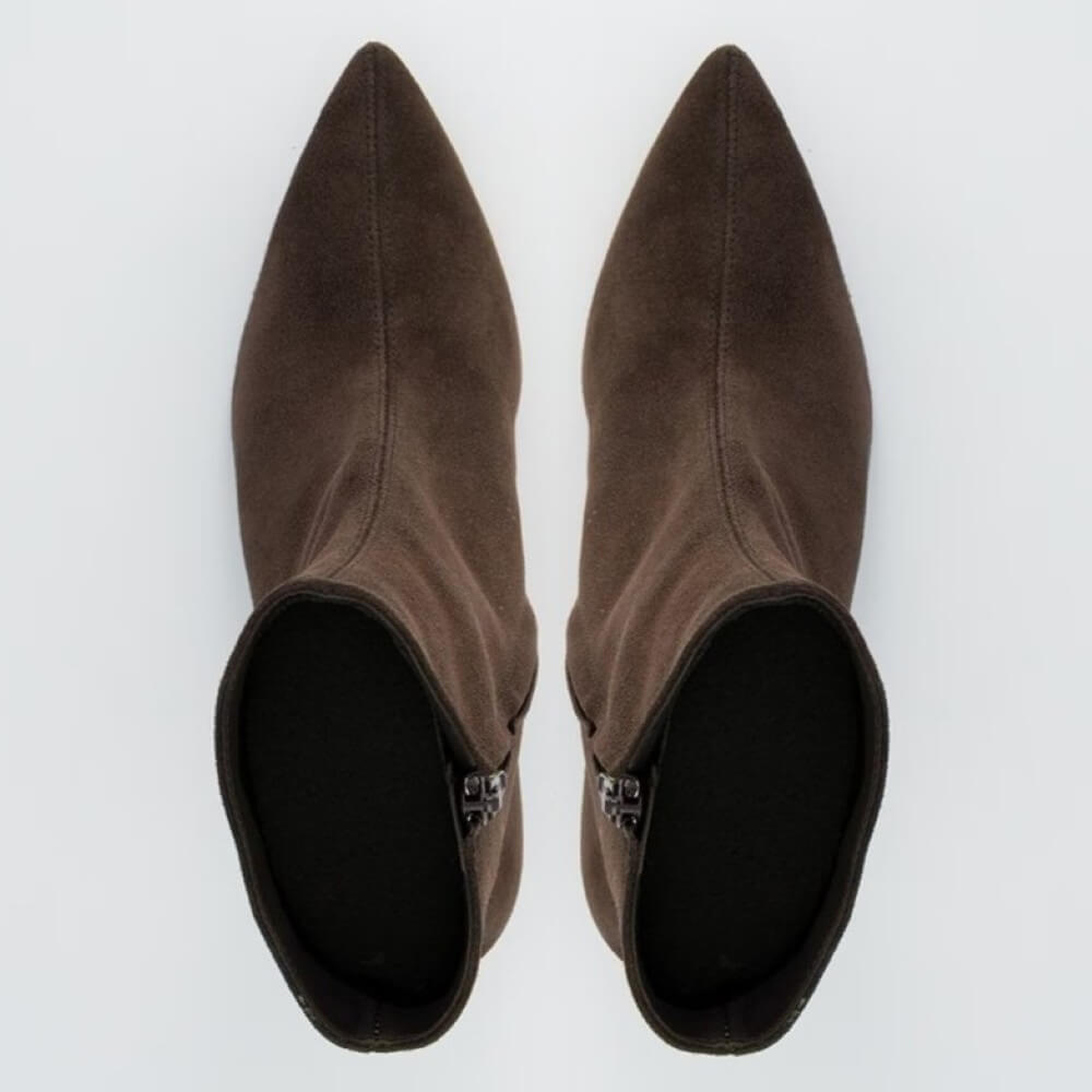 Pair of brown suede ankle boots on a white background
