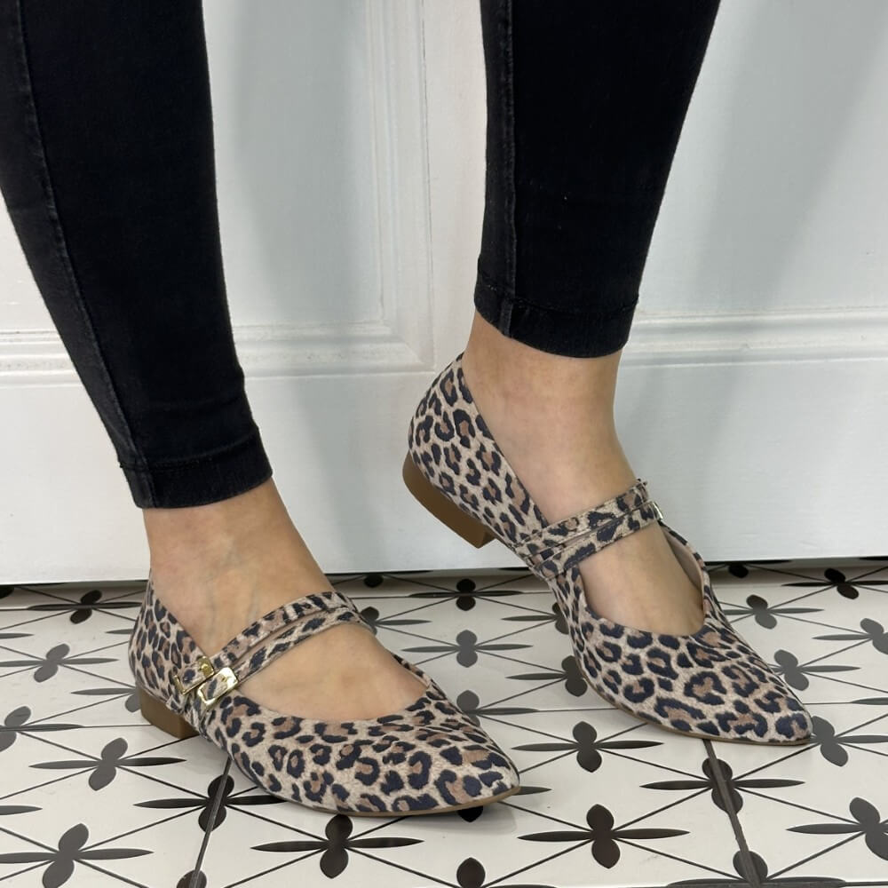 person wearing leopard print Maryjane Ballerinas