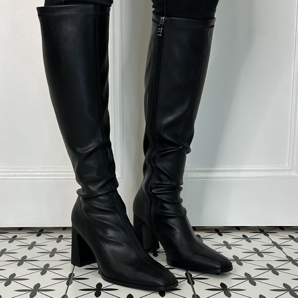 Person Wearing Knee high black boots