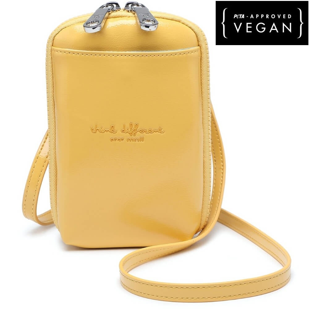 Yellow crossbody bag with a strap on a white background, featuring Pepe Moll branding. Vegan