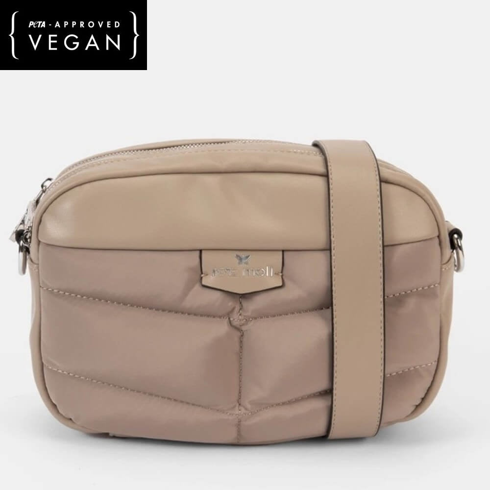Beige crossbody bag with visible brand logo on a white background, featuring 'PETA-Approved Vegan' label.
