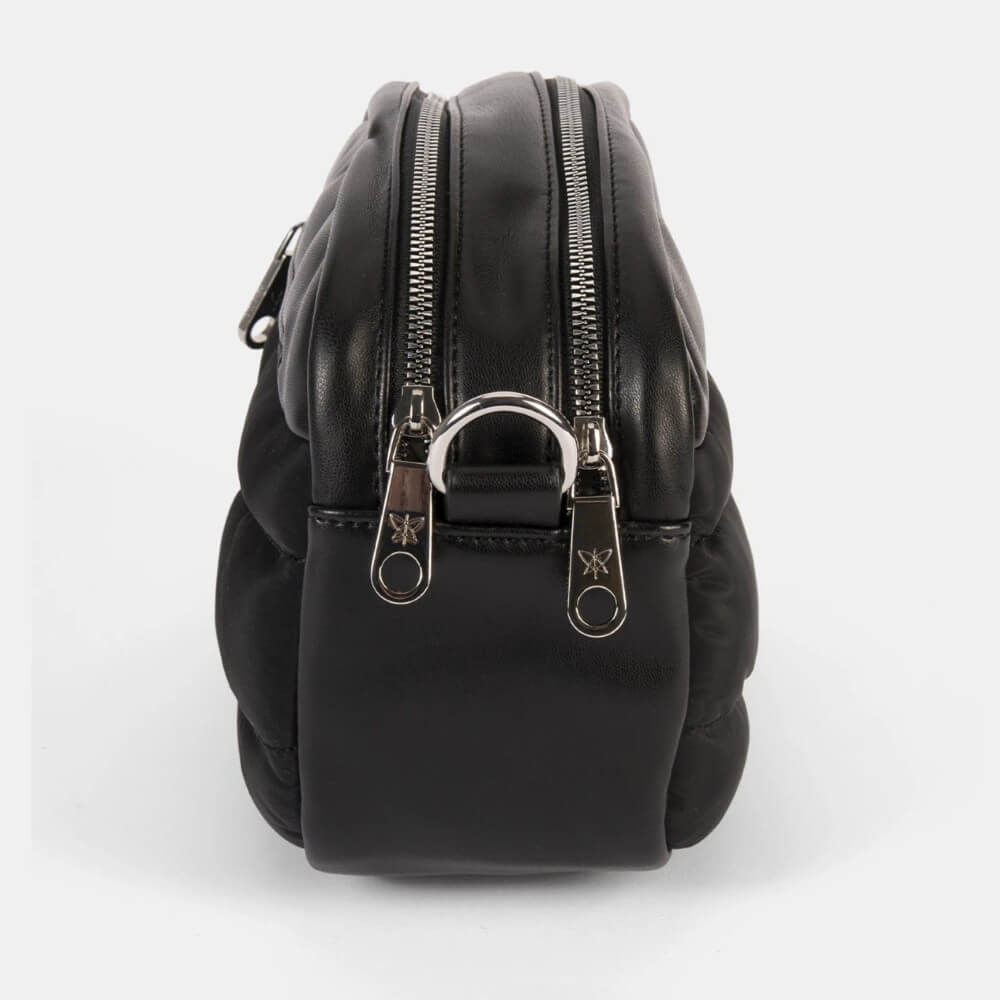 Black backpack with silver zippers and hardware on a white background