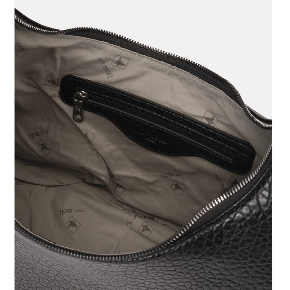 Close-up of a textured bag with a zipper, showing brand logo.