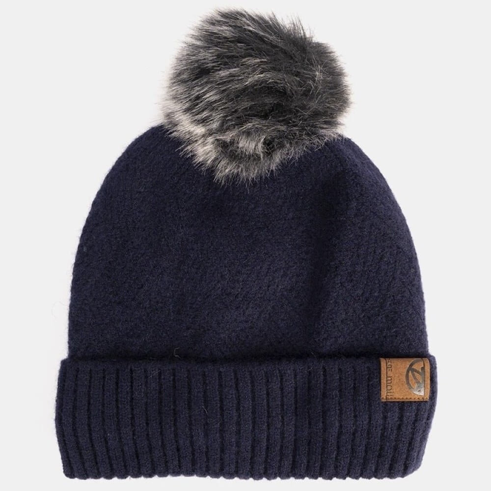 Navy blue beanie with fur pom-pom on a light gray background