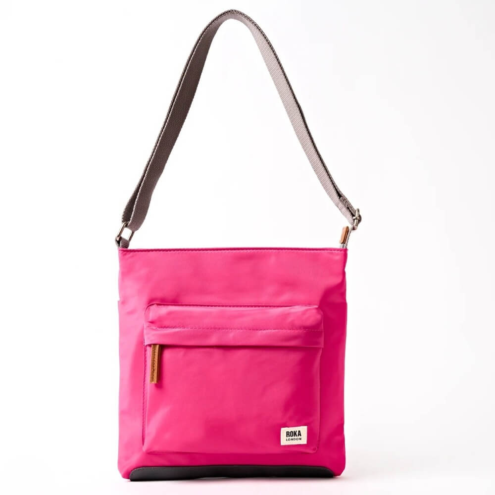 Roka Pink shoulder bag with a strap on a white background