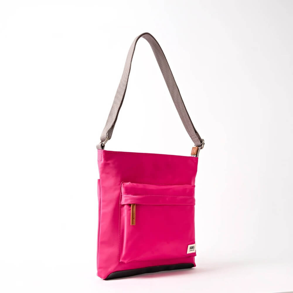 Roka Pink shoulder bag with a strap on a white background