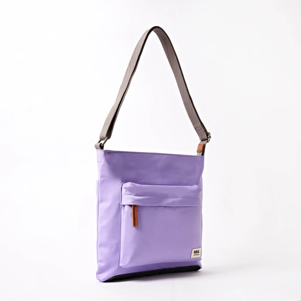 Roka Purple shoulder bag with a grey strap on a white background