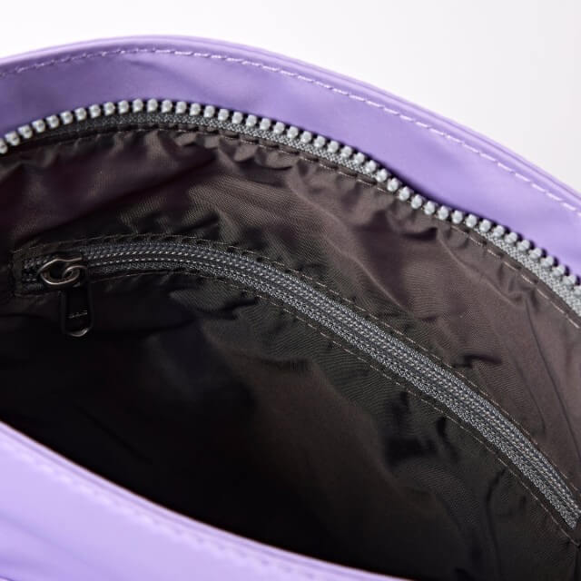 Close-up of a purple bag with a zipper