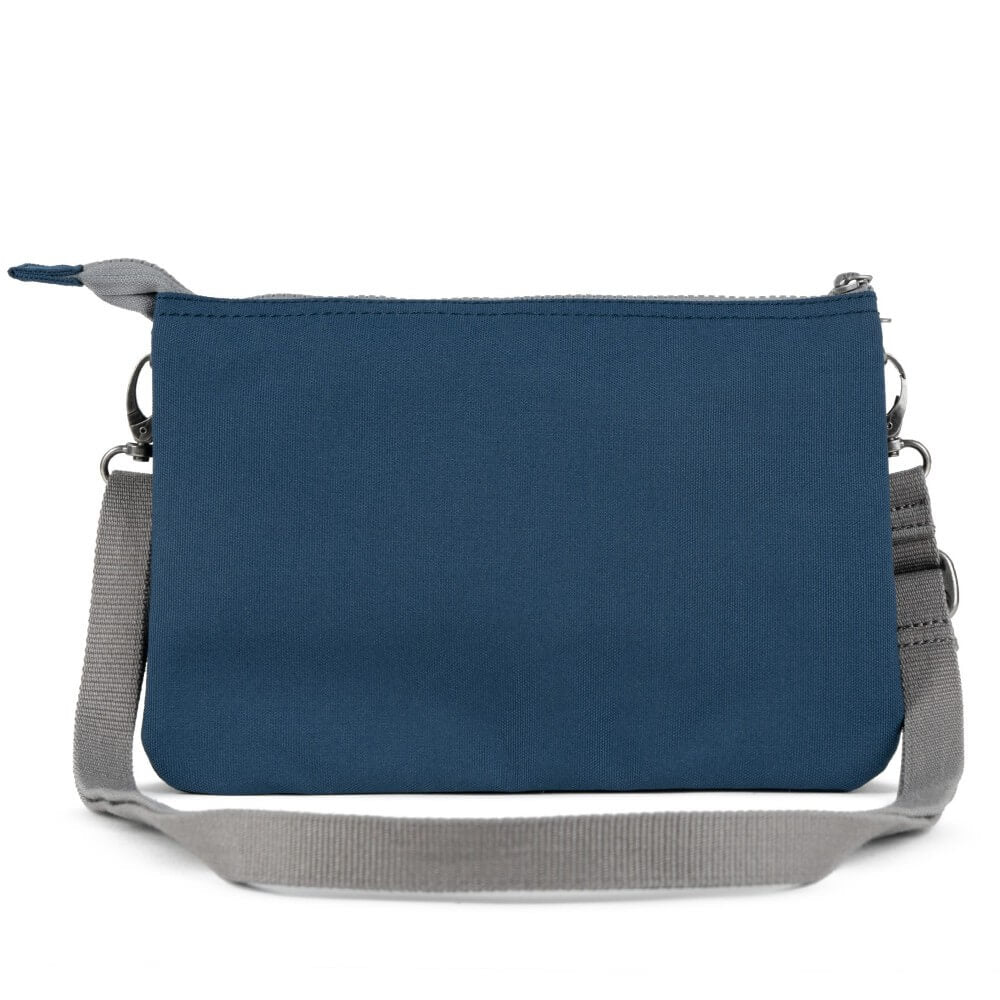 Roka Blue crossbody bag with a visible brand label on a white background