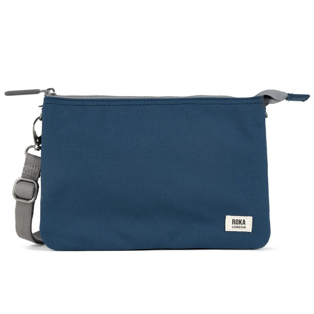 Roka Blue crossbody bag with a visible brand label on a white background