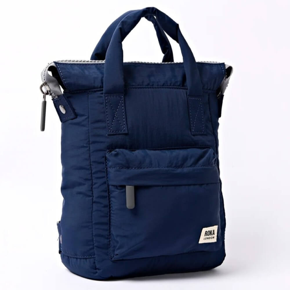 Blue backpack with a Roka logo on a white background