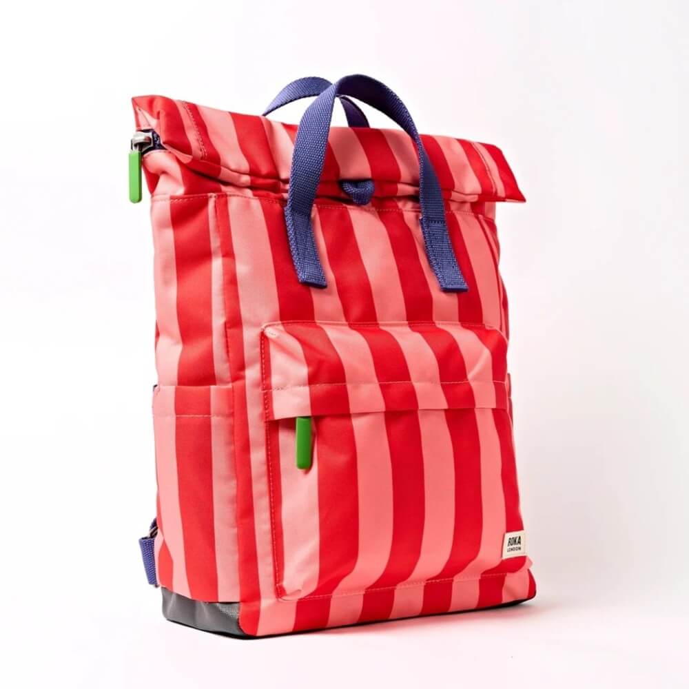 Red and pink striped backpack with blue straps on a white background