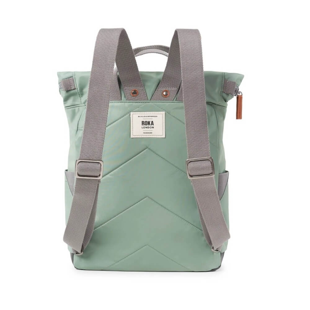 Green backpack with gray straps on a white background