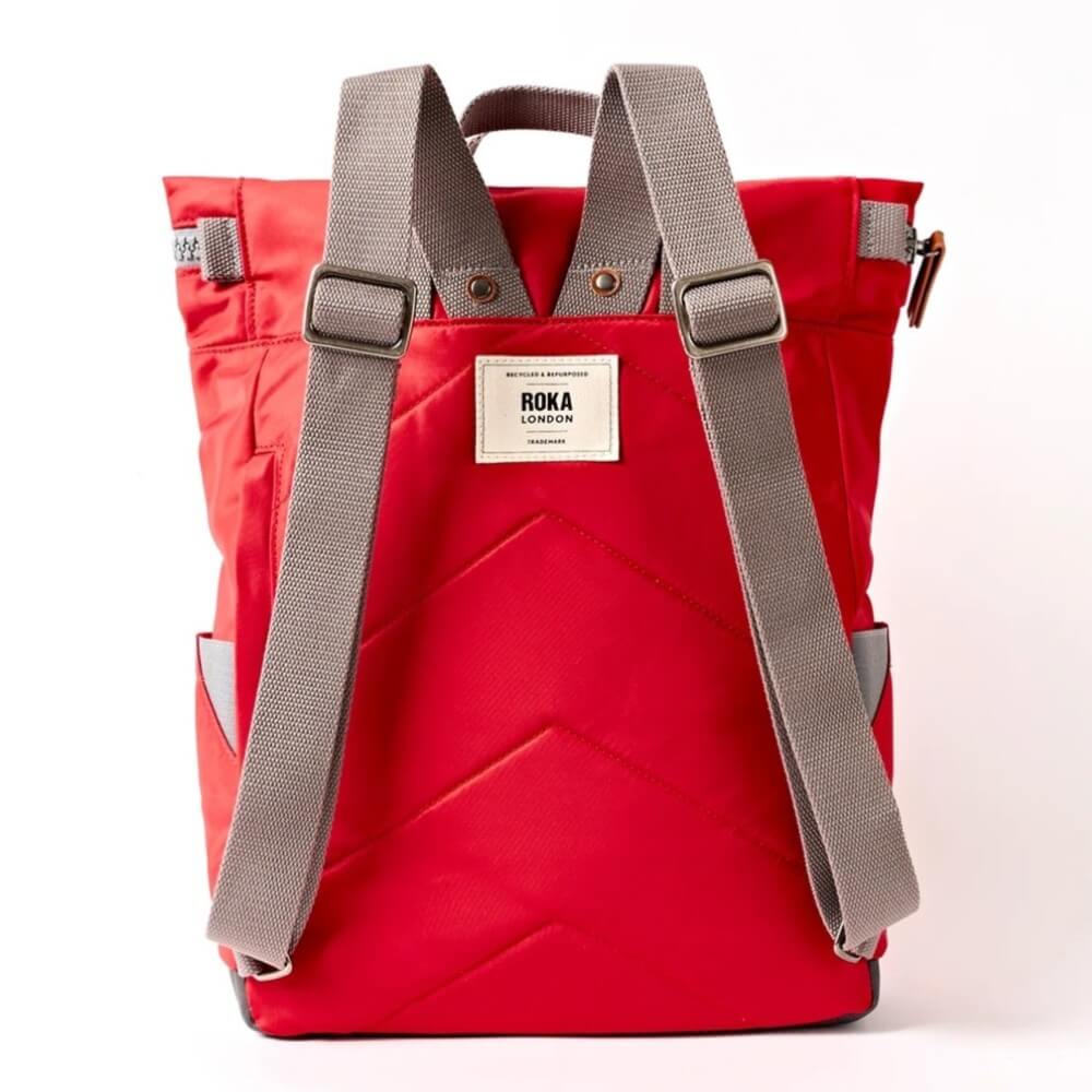 Roka Scarlet Red backpack with grey straps on a white background