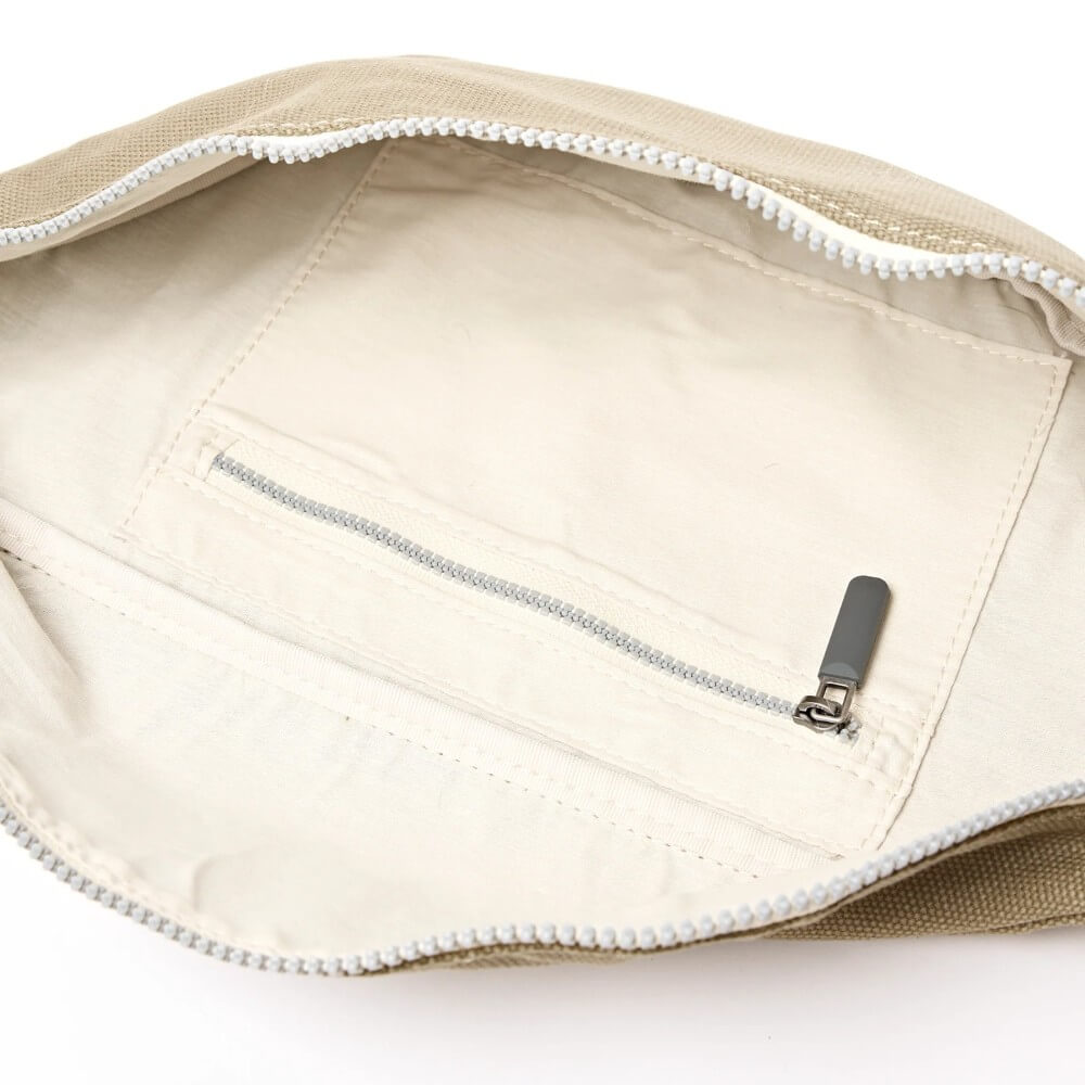 Close-up of a beige pouch with a zipper on a white background