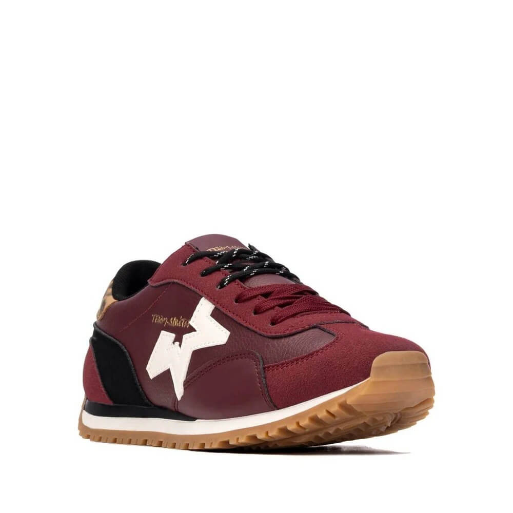 A low-top sneaker by Teddy Smith in burgundy, black, and white, featuring a gum rubber sole, shown from a three-quarters angle on a white background.
