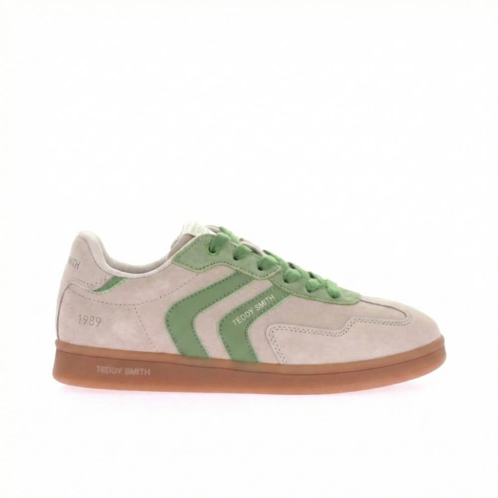 Sneaker with green accents on a white background