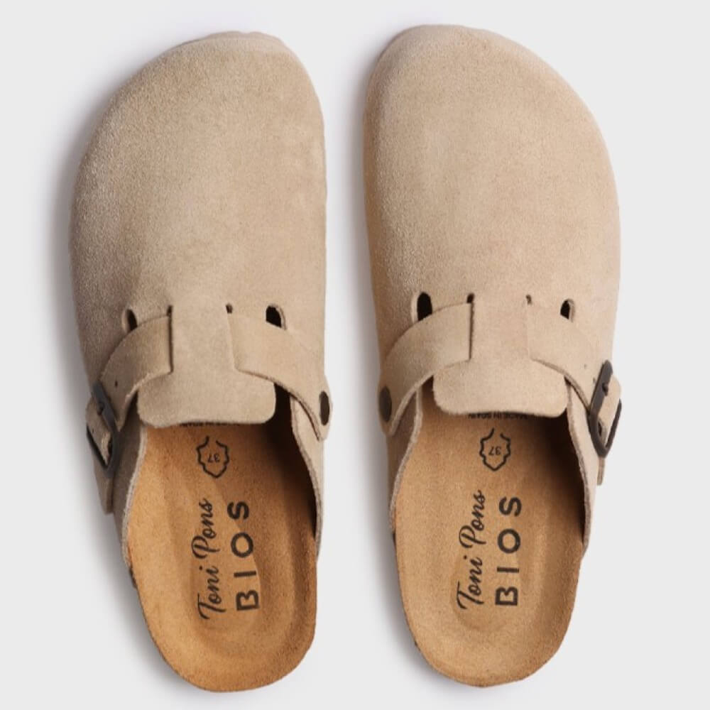 Pair of beige clogs with 'Toni Pons' branding on a white background