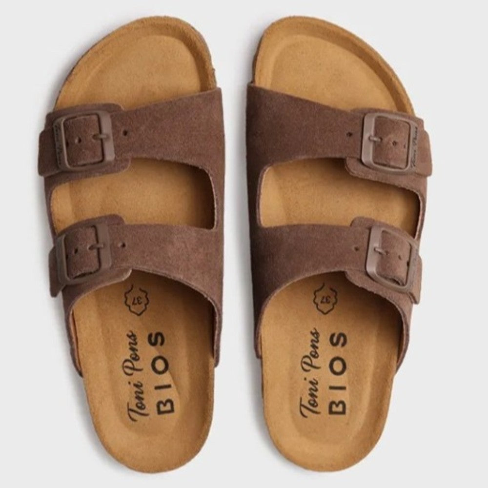 Pair of brown sandals with 'Toni Pons' branding on a light grey background