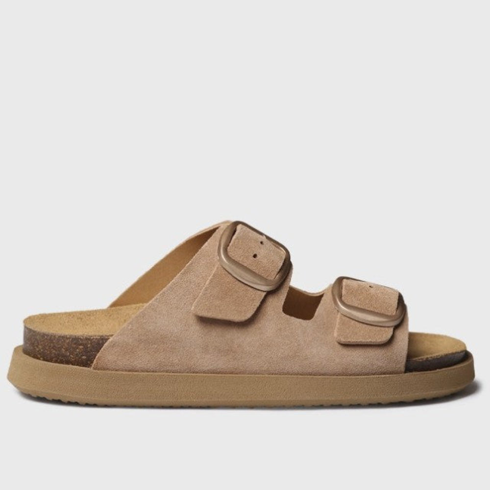 Beige sandal with brown soles on a light gray background