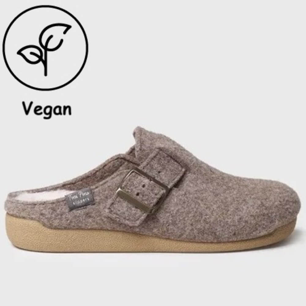 A Toni Pons clog-style slip-on shoe in heathered taupe-brown felt with a tan sole, shown in side profile on a light gray background. A black circular 'Vegan' leaf icon and text appear in the upper left corner.