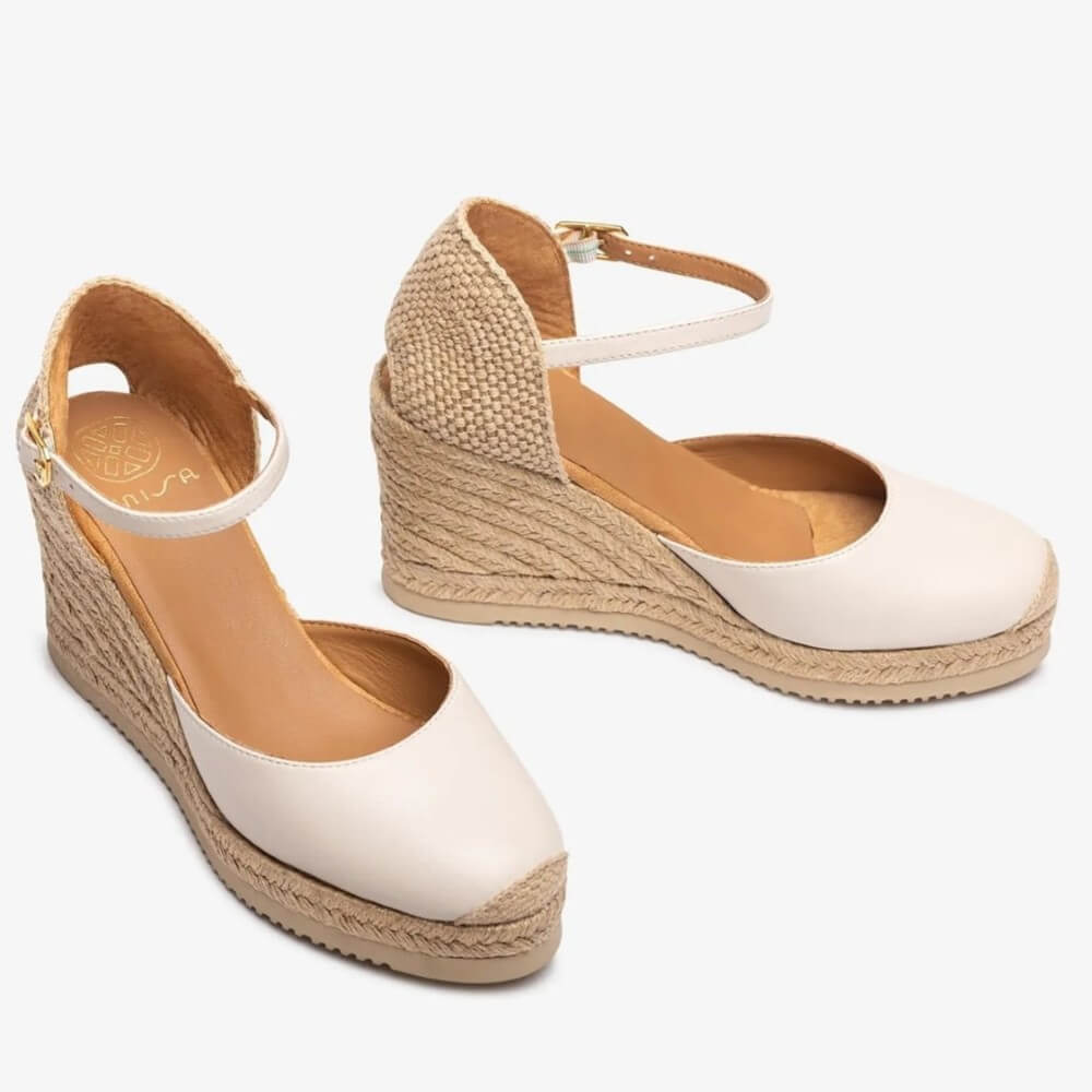ivory wedge sandals with jute sole on a white background