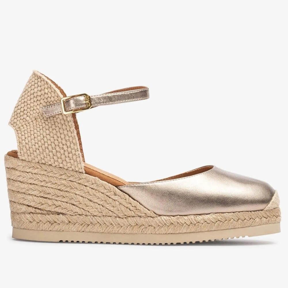 Unisa Gold wedge sandal with metallic strap on a white background