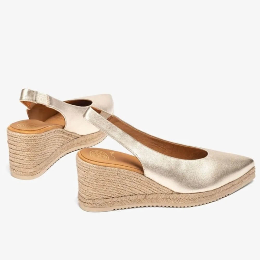 Unisa Gold wedge sandals with espadrille sole on a white background