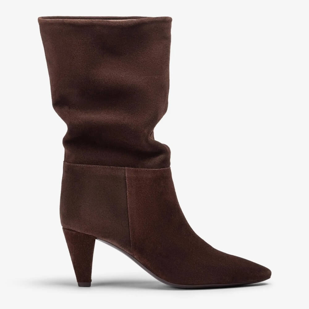 A Unisa dark brown suede slouch boot with a pointed toe and a mid-height stiletto heel, shown from a side profile on a light grey background.