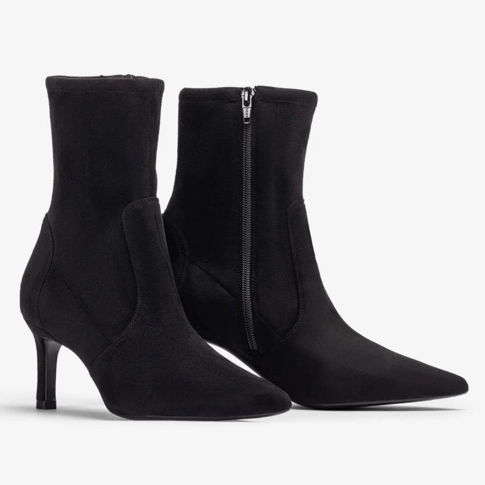 A pair of Unisa black pointed-toe ankle boots with mid-height stiletto heels and side zippers, shown against a plain light grey background.