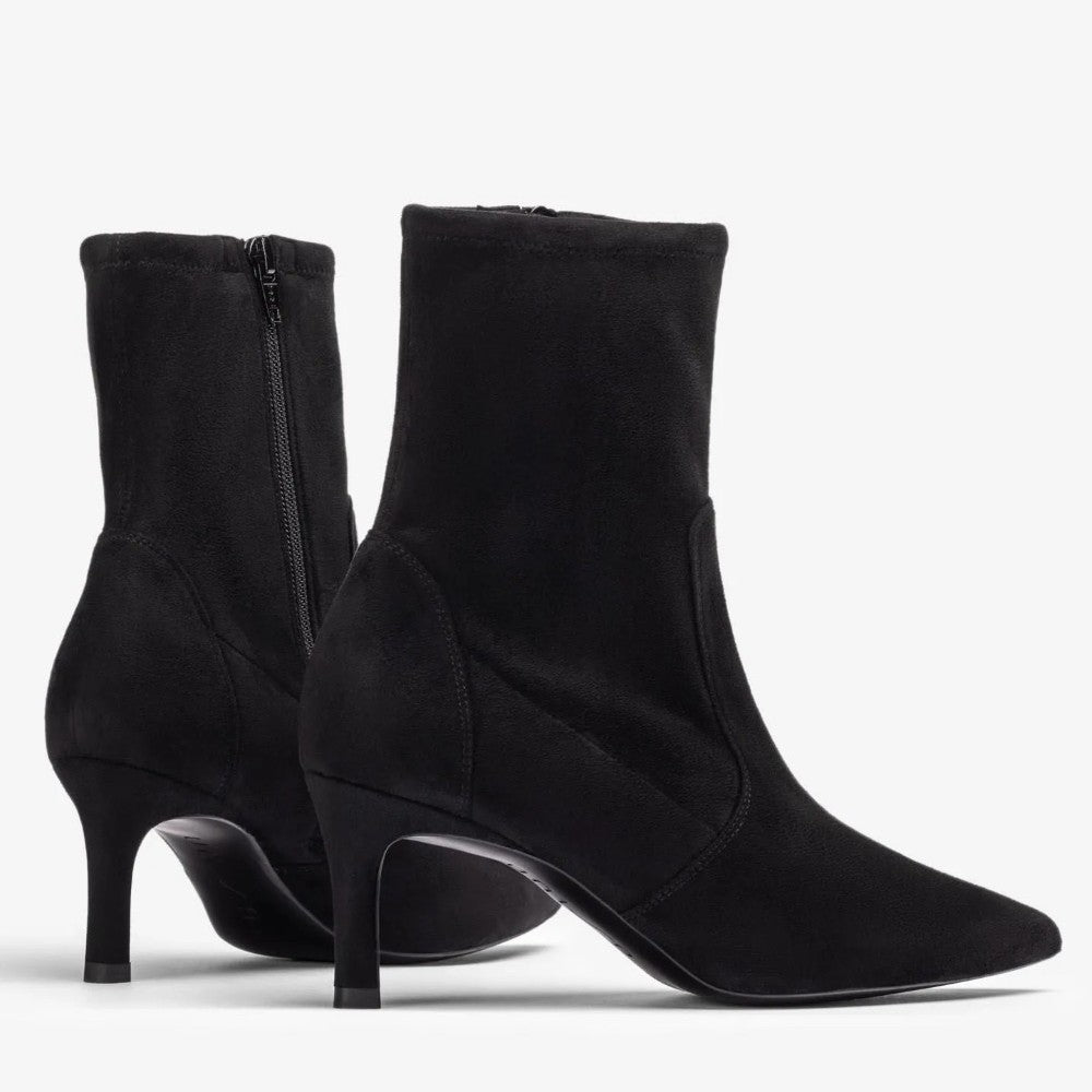 A pair of black suede ankle boots with kitten heels, shown from the side and back on a light gray background.