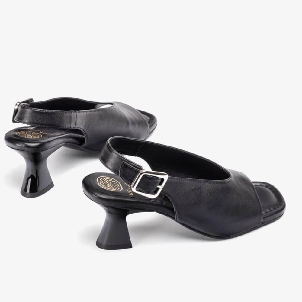 Unisa Black Slingback Peep-toe sandal with a buckle on a white background